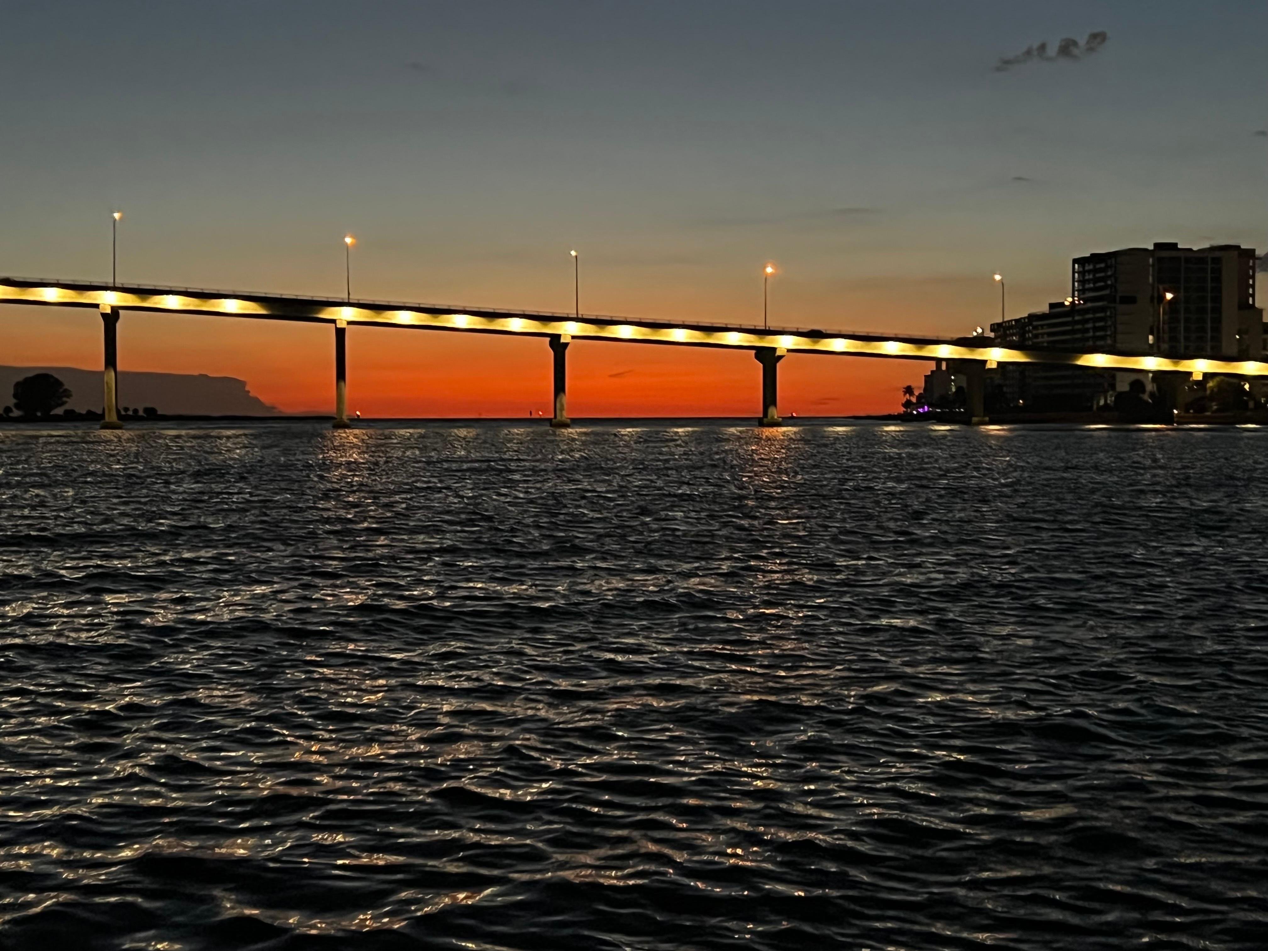 Sunset & Harbor Lights Cruise, sunlit Clearwater shoreline from the boat