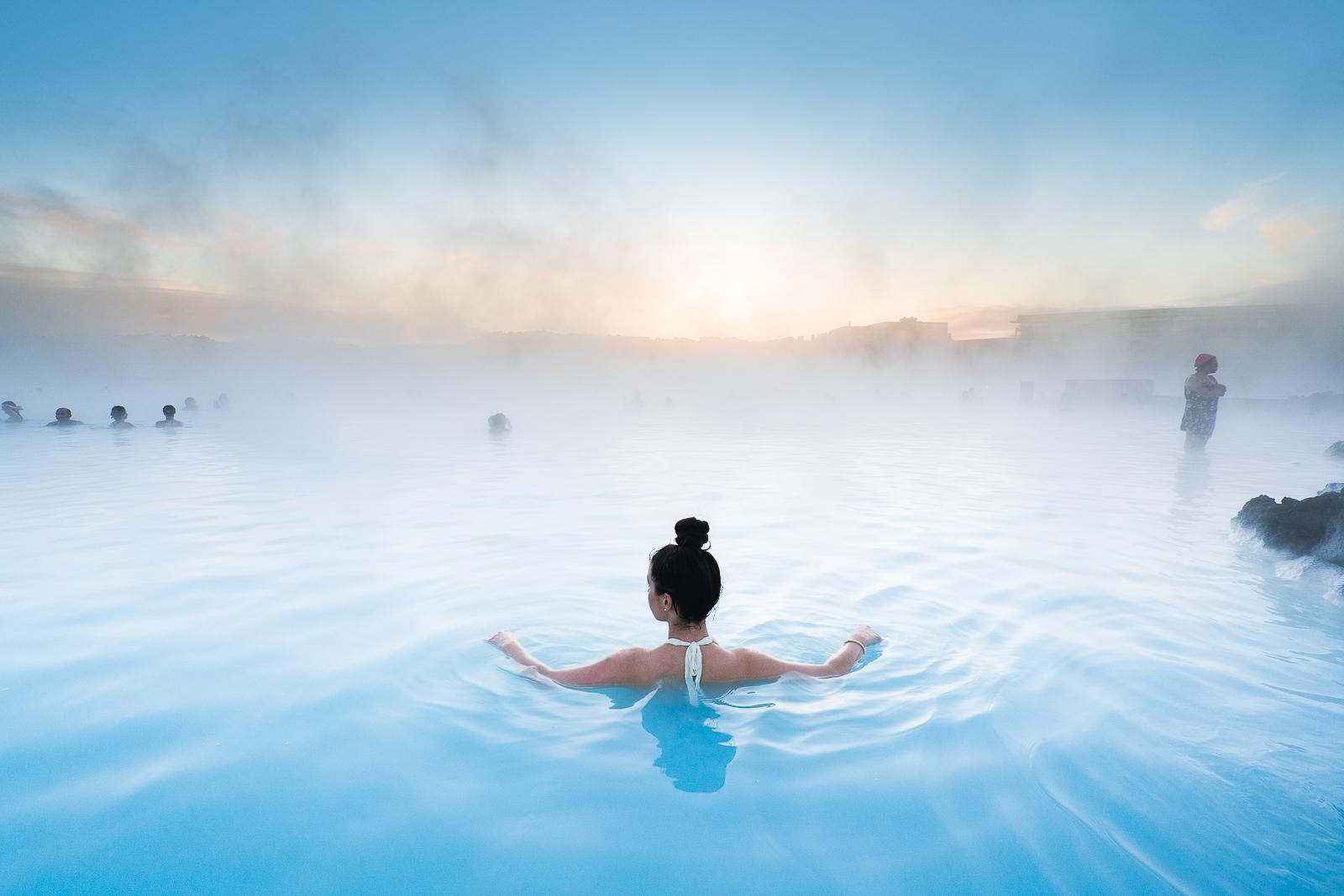 Blue Lagoon silica-rich geothermal water steaming over black lava, Reykjanes Peninsula Iceland
