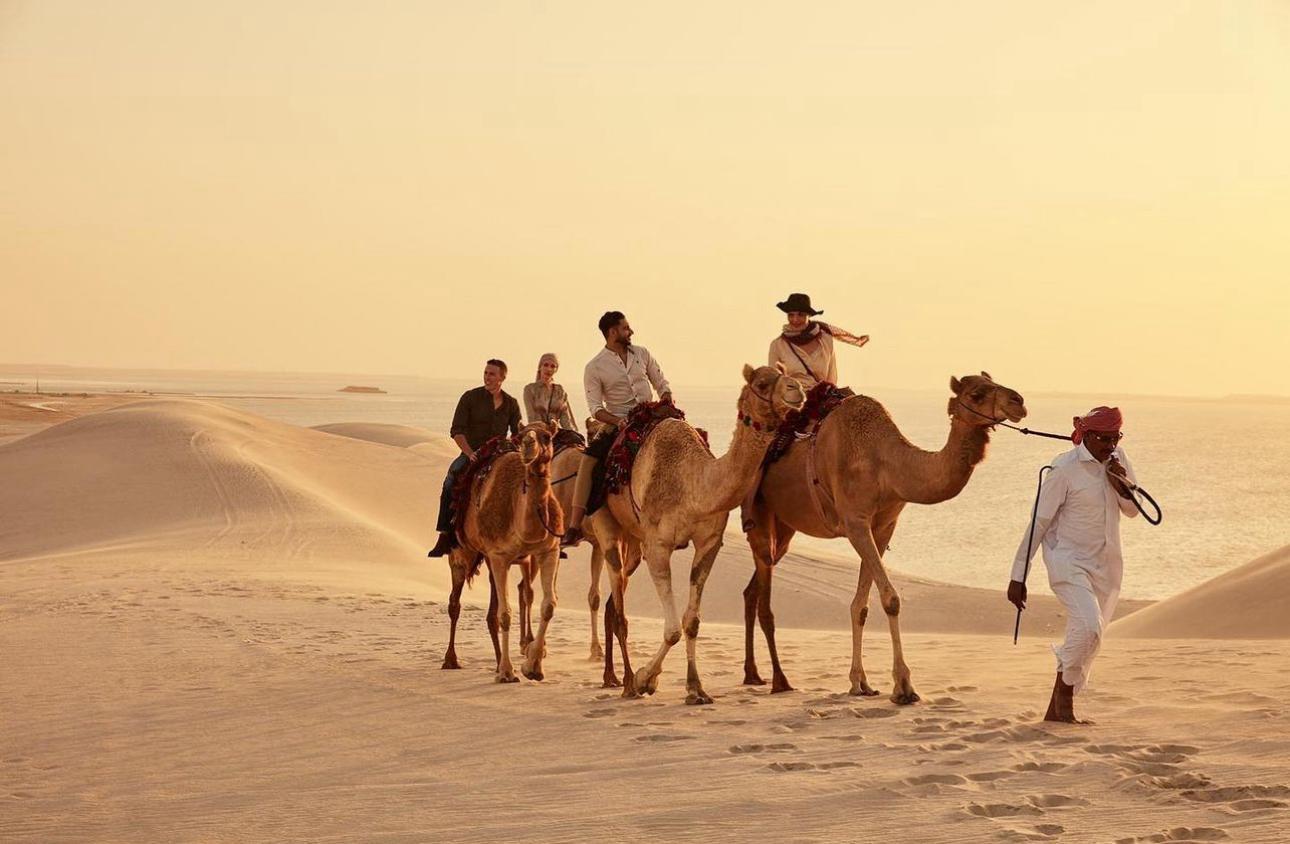 Doha Desert Safari: Sunset Dune Bashing, Camel Ride & Sandboarding