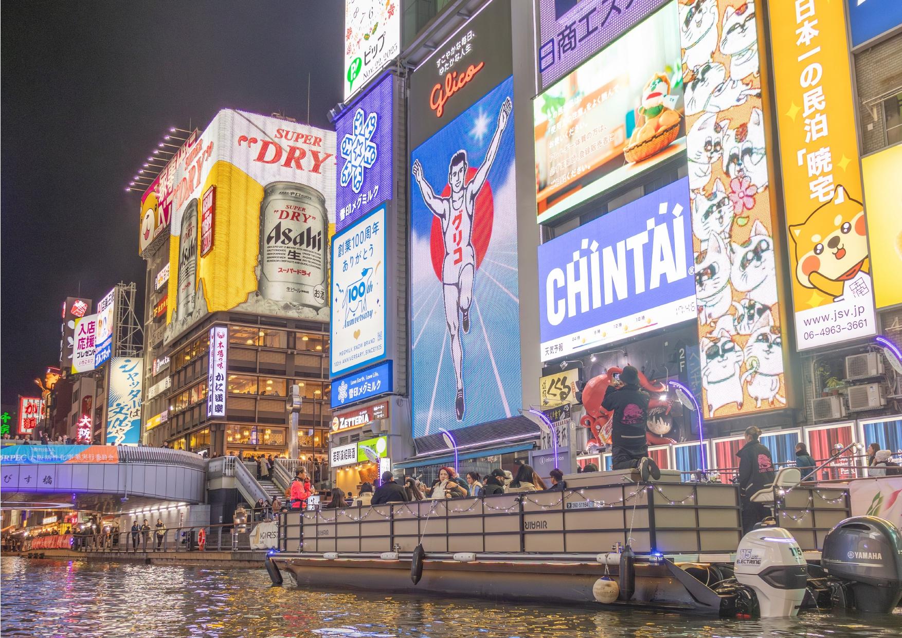 Dotonbori river cruise — Glico sign and neon on the Osaka canal — image 2