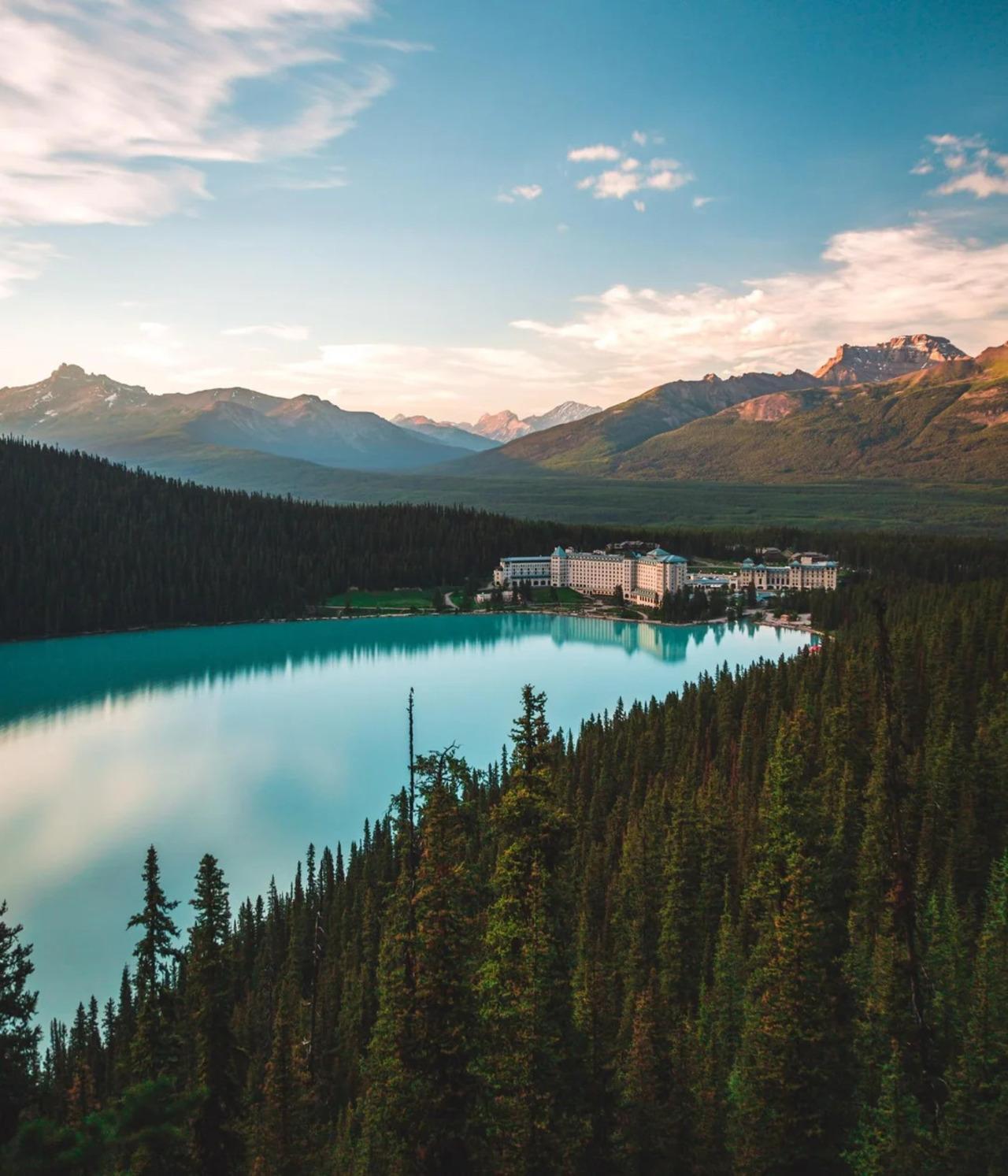 Lake Louise red canoe turquoise glacial water Victoria Glacier Banff National Park — image 10