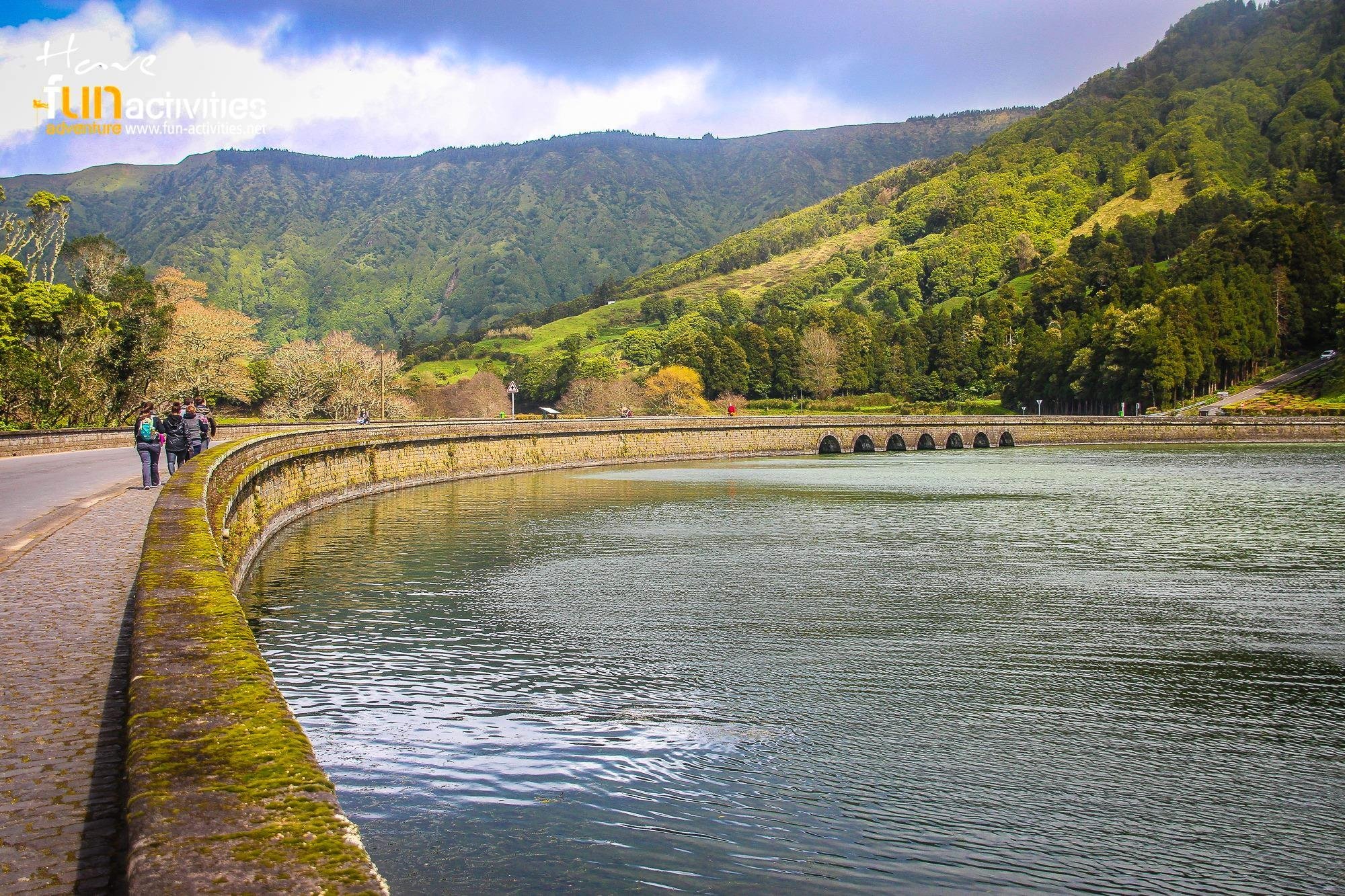 Stone-edged lake below the green Sete Cidades crater slopes