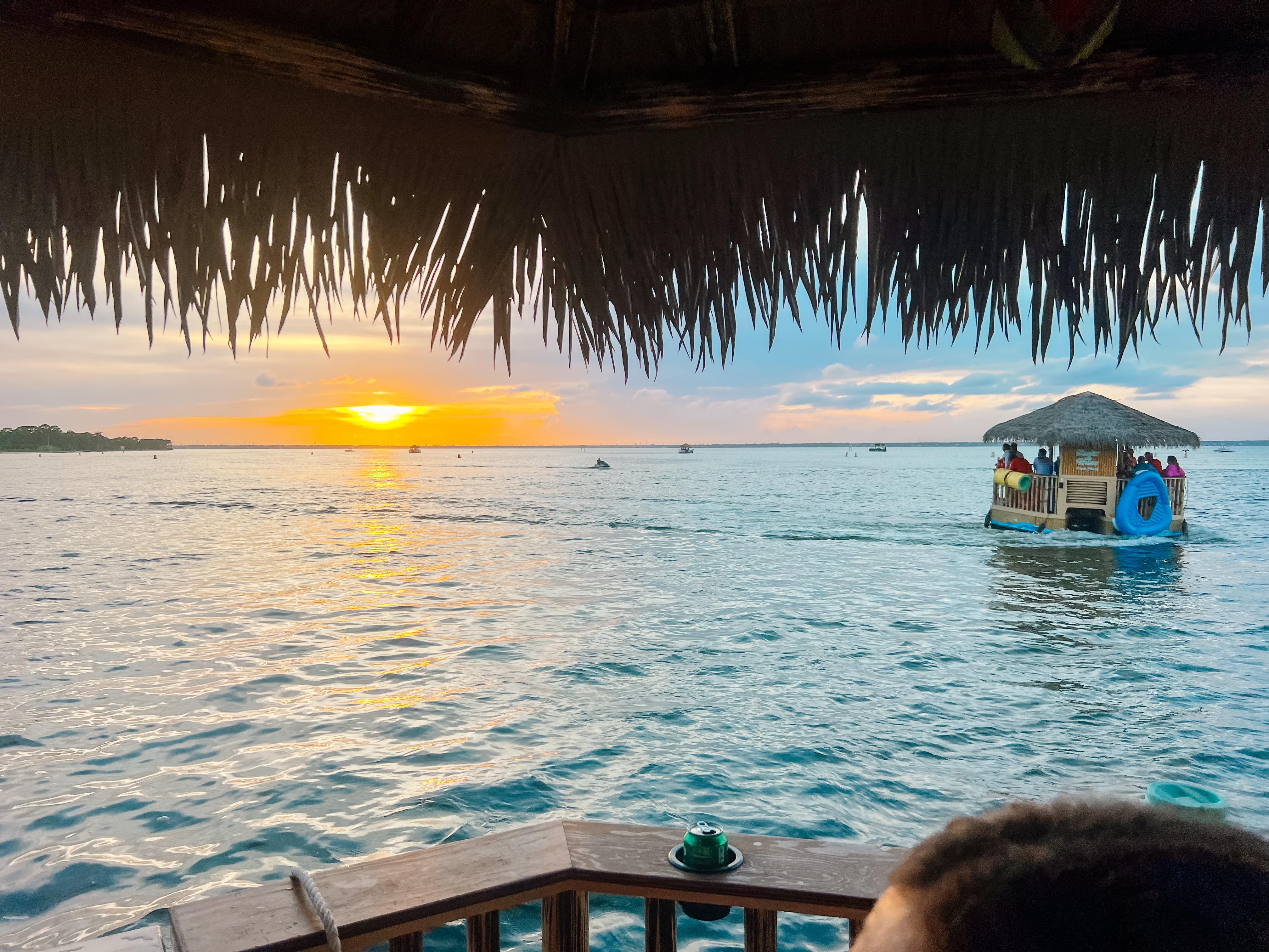 Crab Island Sunset Cruise on Tiki Boat with Dolphin Watching