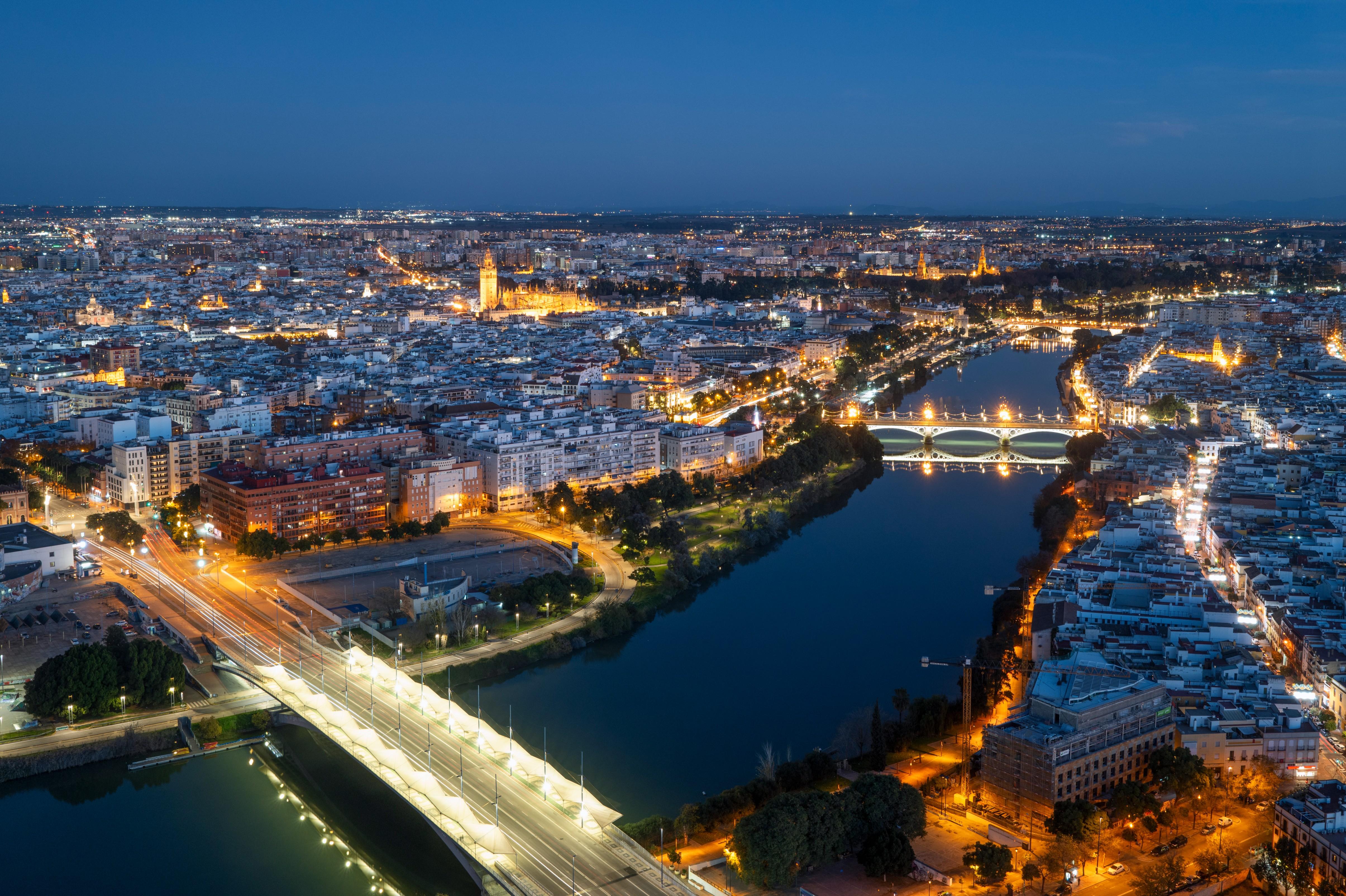 Seville Nocturnal Discovery: Historic Center & Riverside Walk
