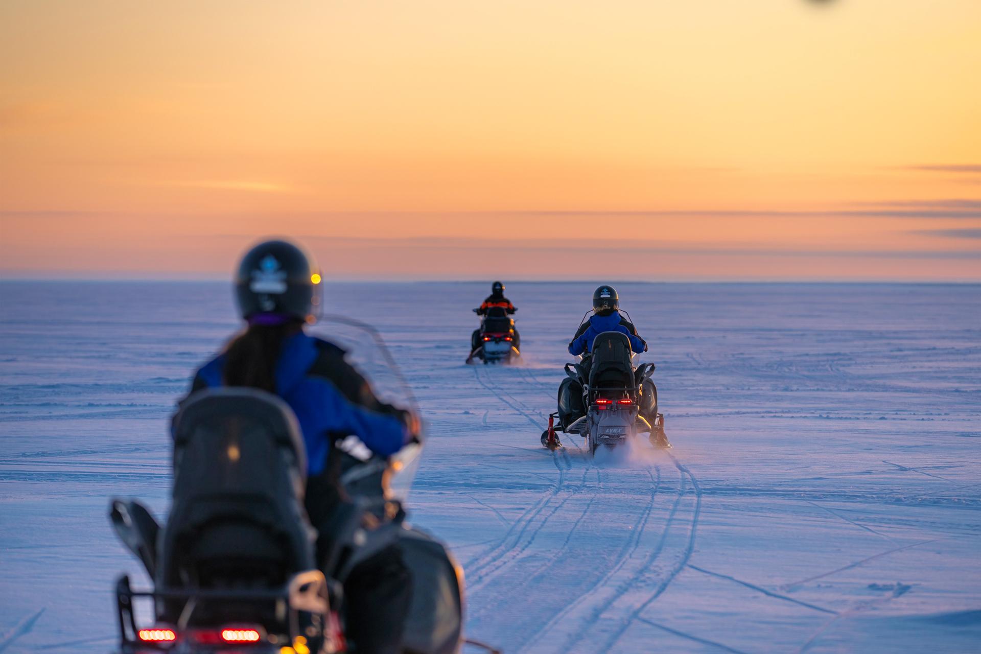 Frozen Bay Sunrise Snowmobile Adventure