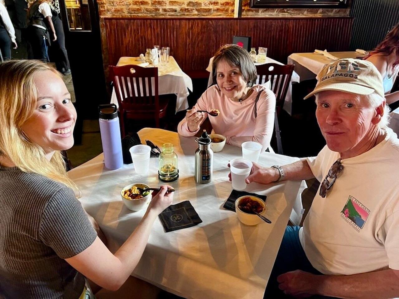 Guests on a combined New Orleans cooking tour and food walking experience