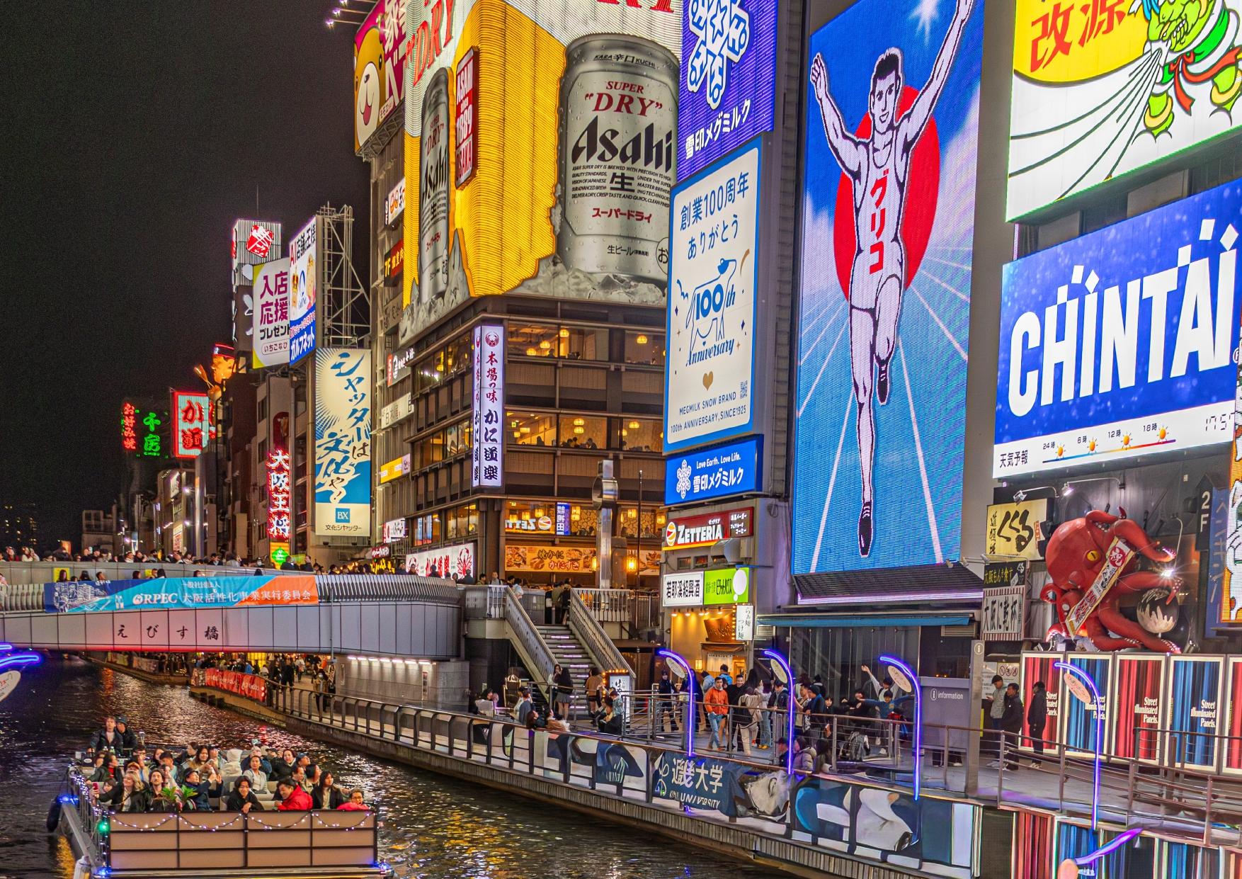 Dotonbori river cruise — Glico sign and neon on the Osaka canal — image 1