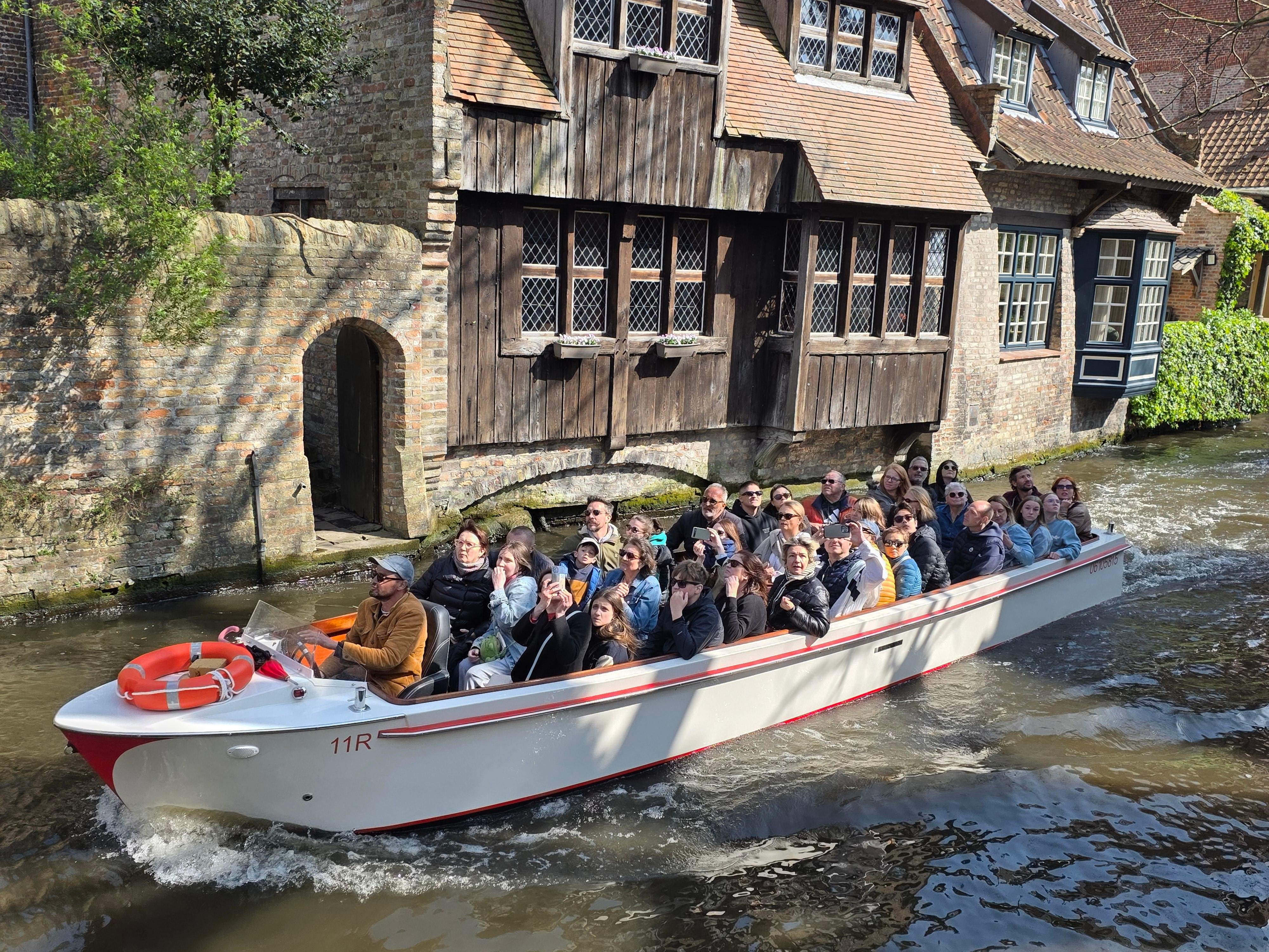 Bruges canal boat tour — medieval canals, low bridges, the Belfry and the Beguinage in the Venice of the North — image 23