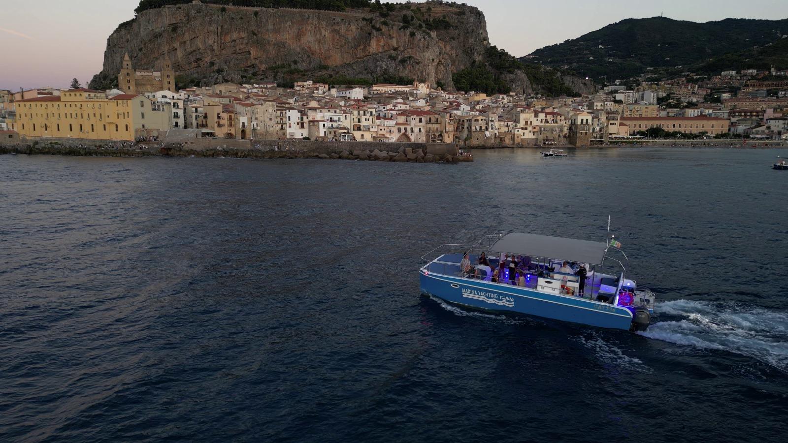 Cefalù coast to coast boat tour — catamaran on the Sicilian coast — image 3