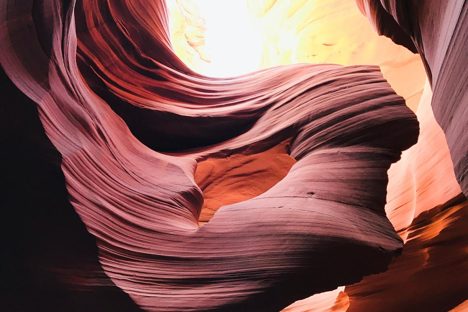 Looking up at the wide open top of the V-shaped Lower Antelope Canyon slot