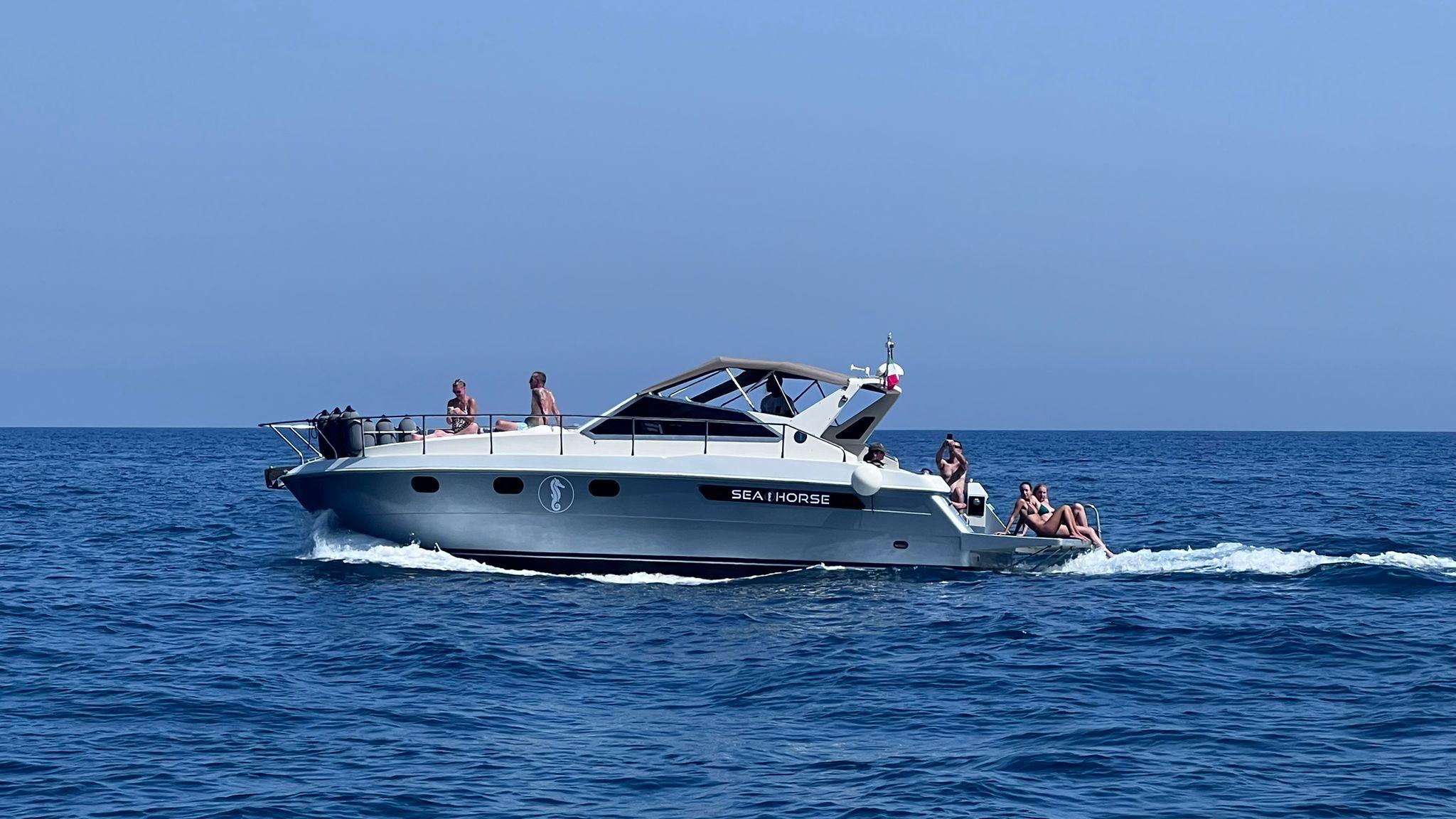 Amalfi Coast Gozzo Boat Tour: Caves, Beaches & Prosecco from Positano