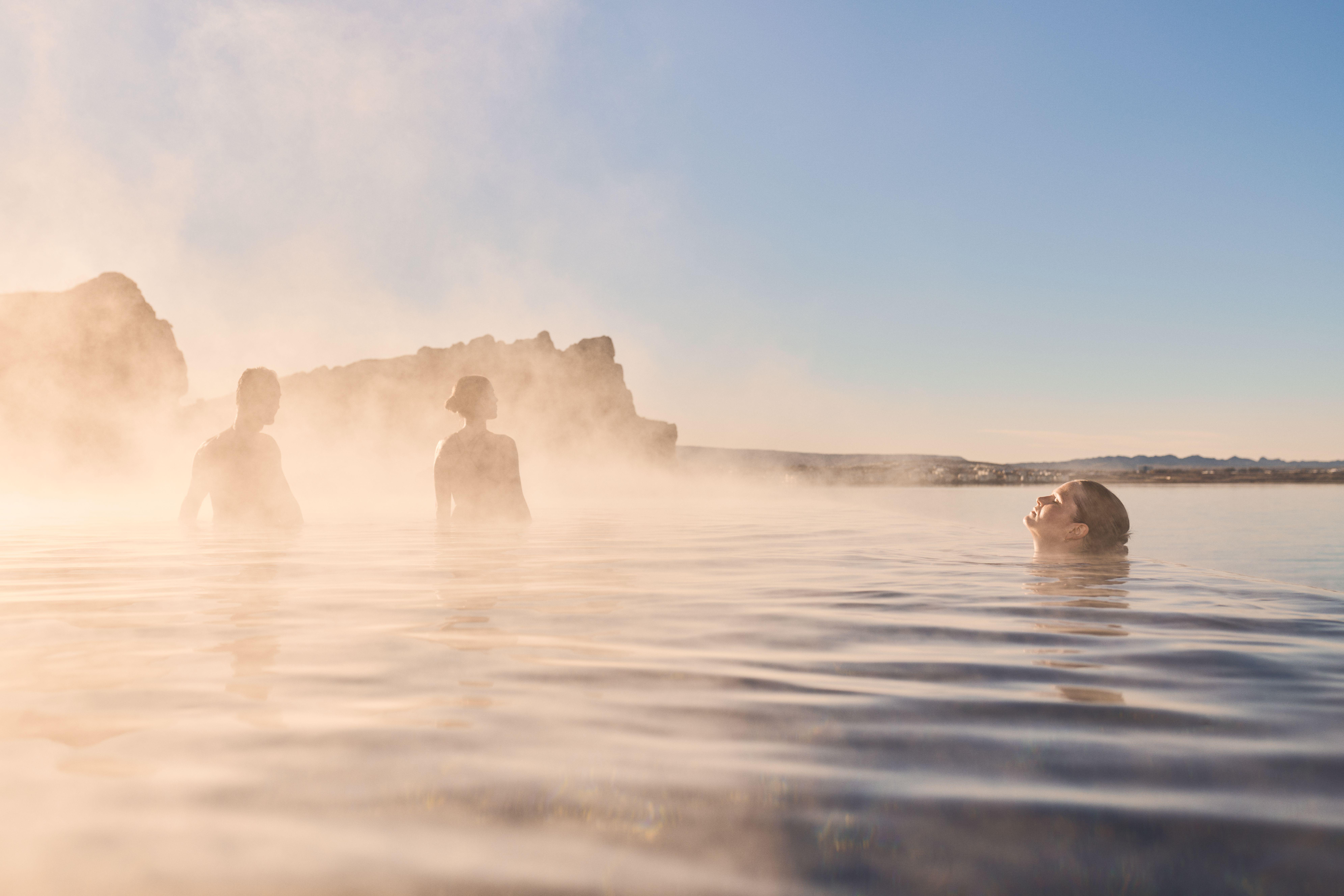 Sky Lagoon entrance pass — soaking in geothermal water at sunset over the Atlantic, Reykjavik