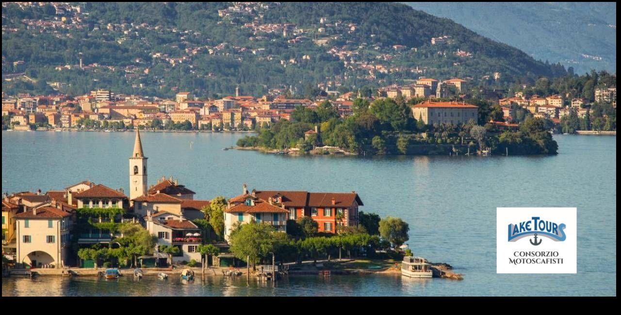 Tour boat sailing between the Borromean Islands on Lake Maggiore with the Alps visible on the horizon