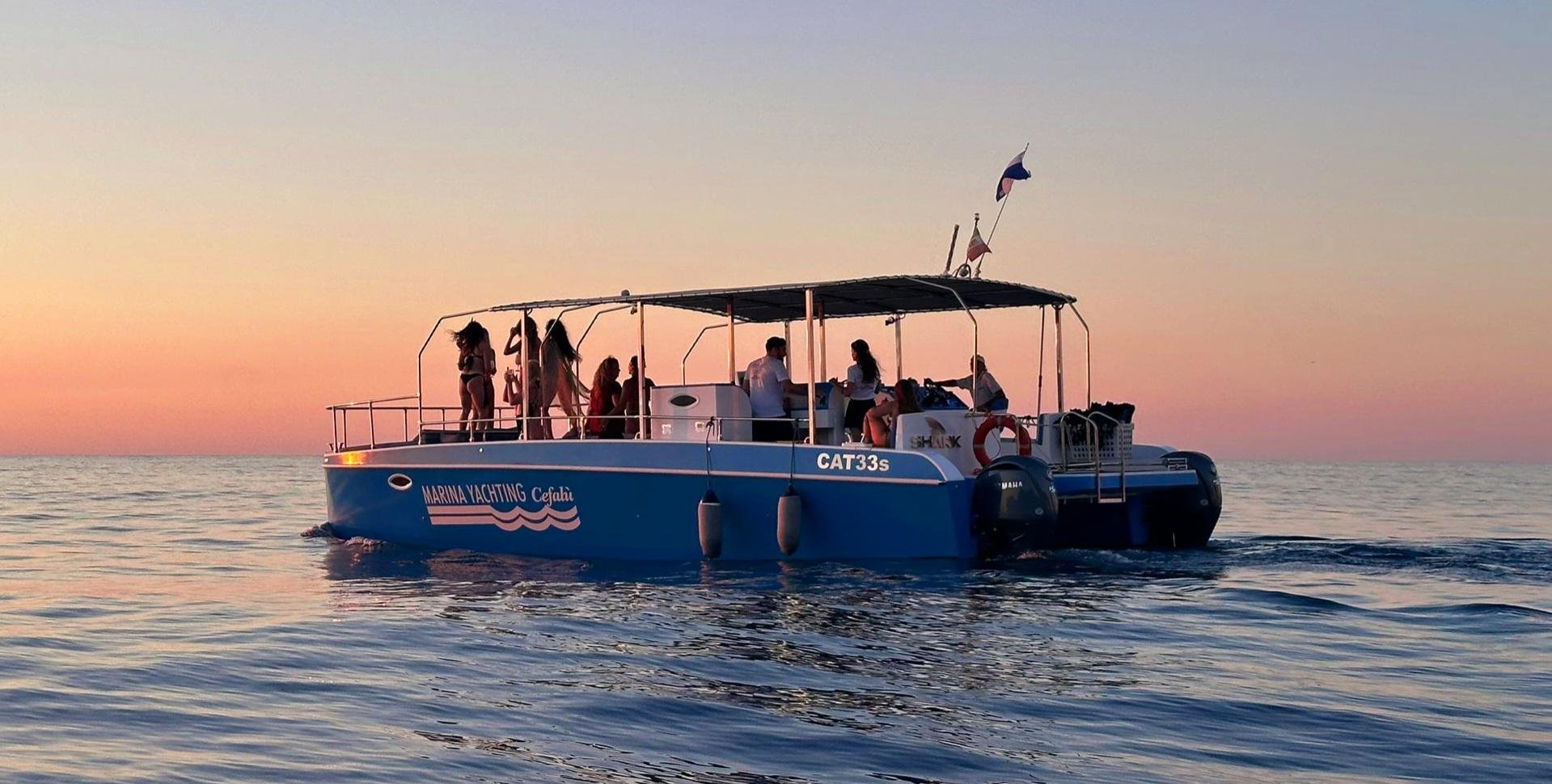 Cefalù coast to coast boat tour — catamaran on the Sicilian coast — image 2