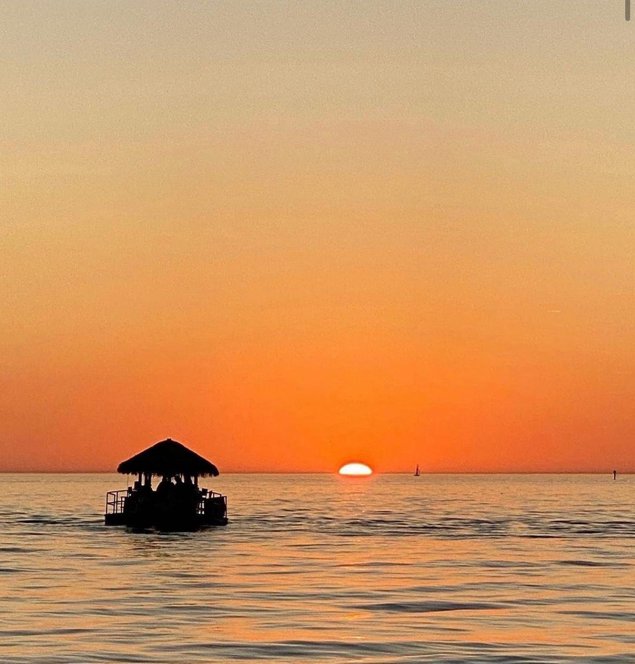 Sunset Tiki Cruise, travellers sharing the on-water experience