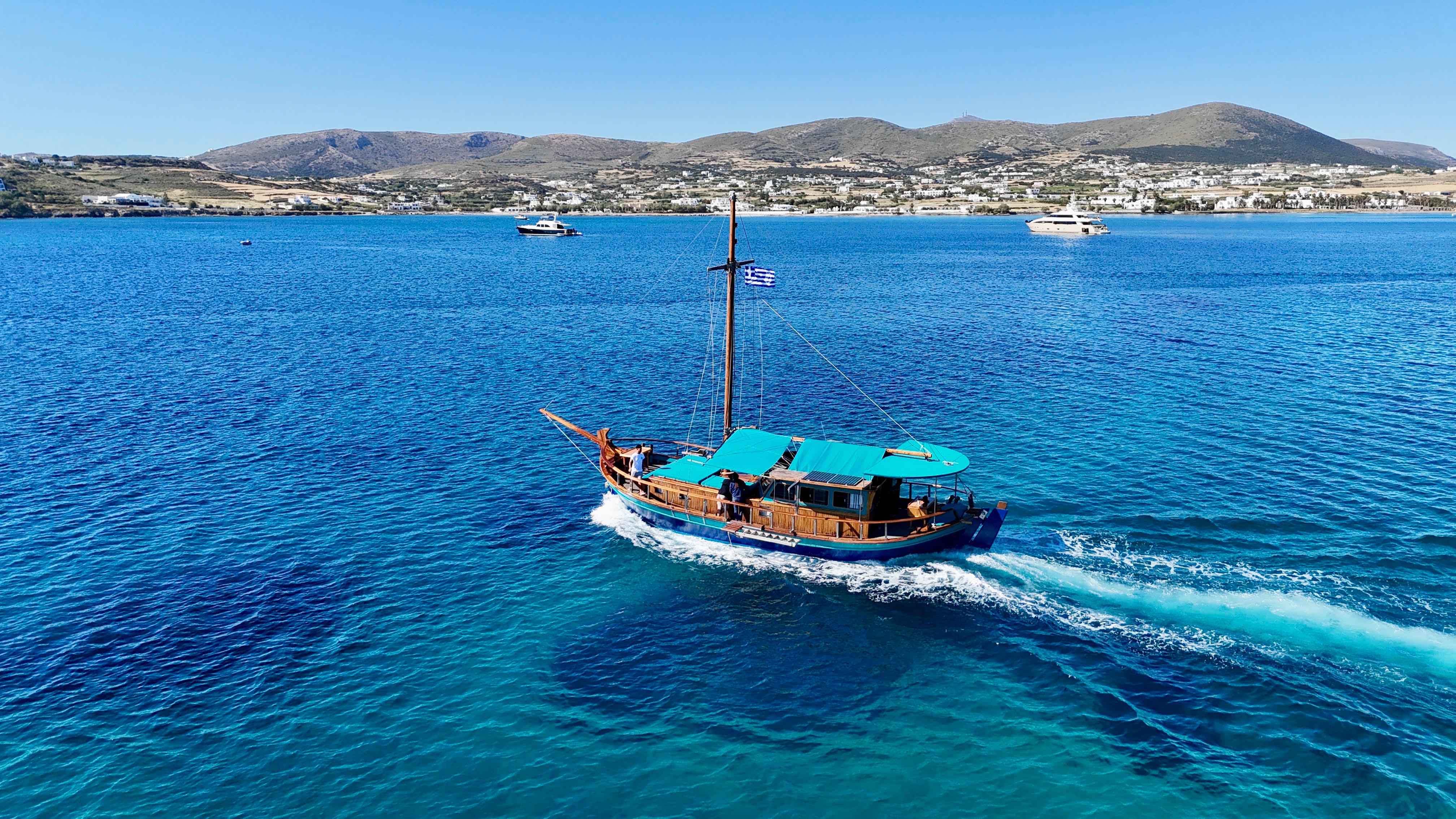 Naoussa Bay Wooden Boat Cruise with Snorkeling