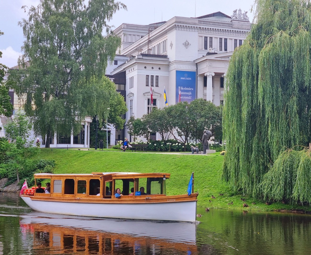 Historic Wooden Boat Journey Through Riga's Waterways