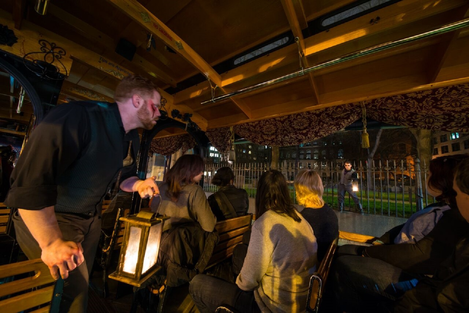 Boston ghost tour — Granary Burying Ground at night, centuries-old slate headstones in historic downtown Boston