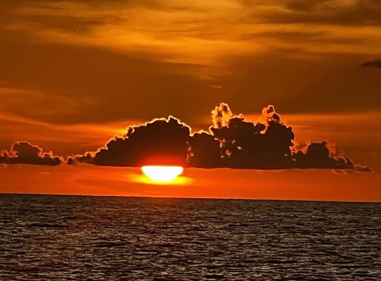 Sunset Tiki Cruise, the lead tour returning across calm water