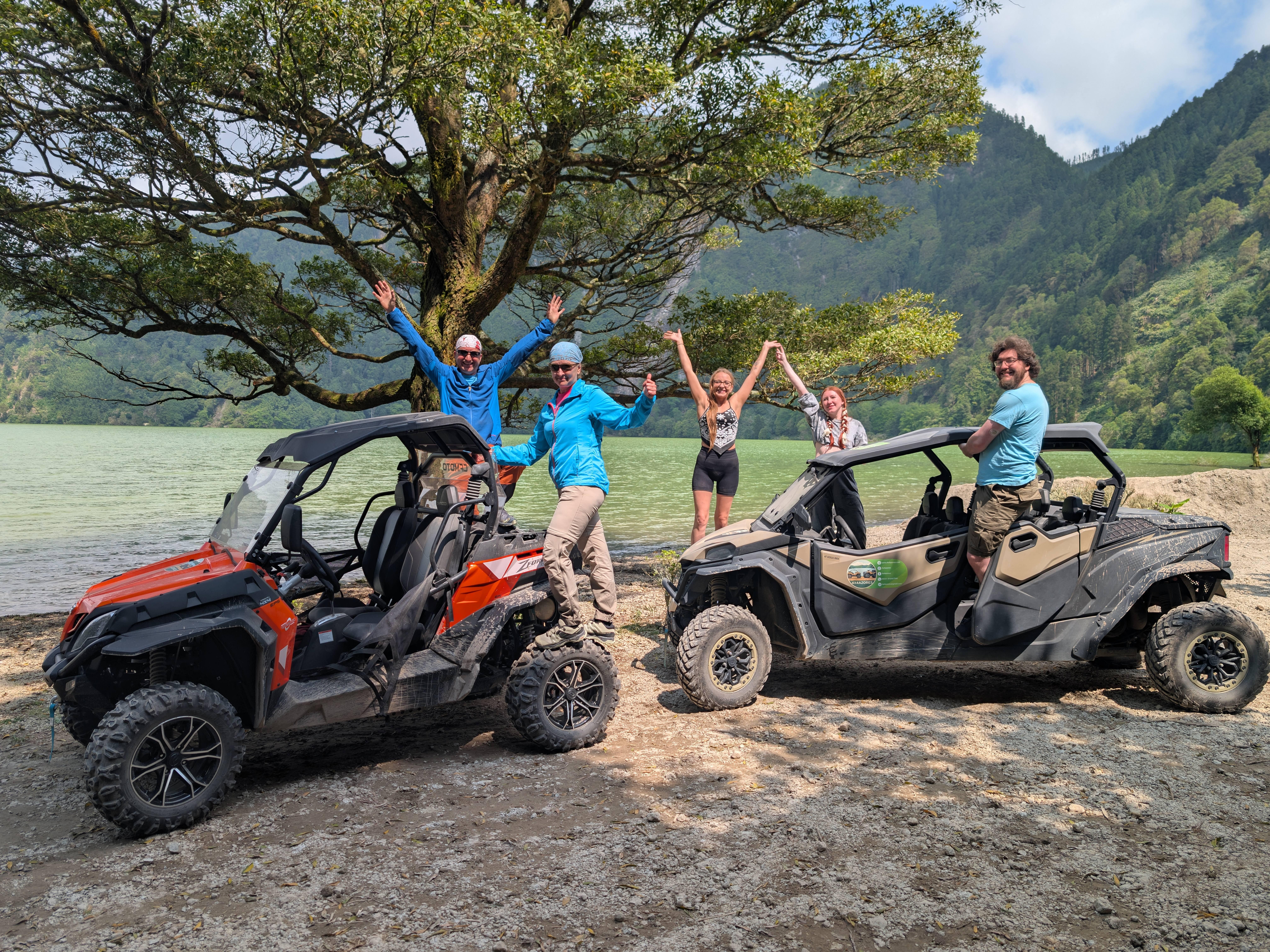 Travellers beside two buggies near Lagoa das Sete Cidades