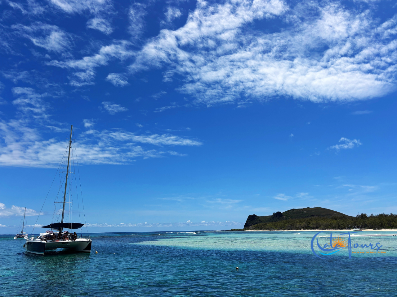 Flat Island Catamaran Cruise with Beach BBQ