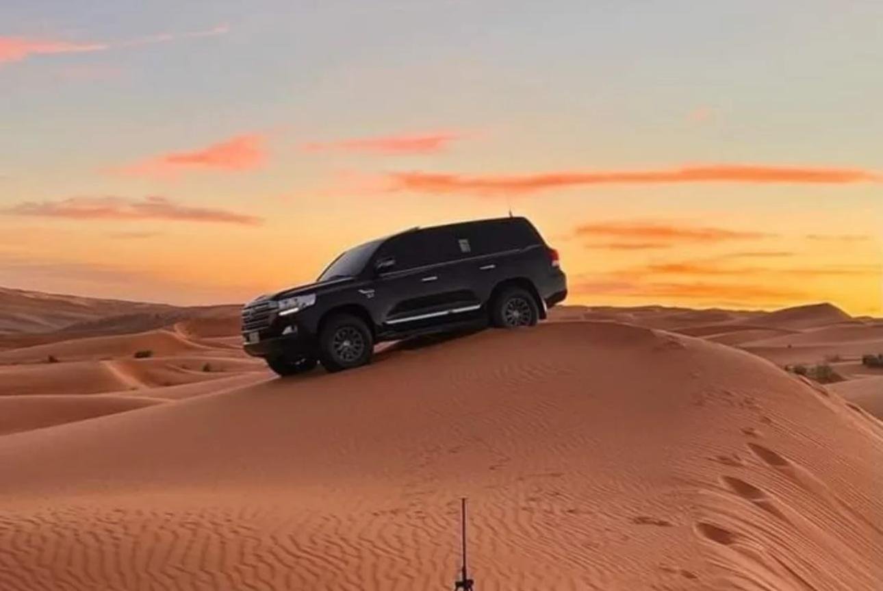 Doha Desert Safari: Sunset Dune Bashing, Camel Ride & Sandboarding