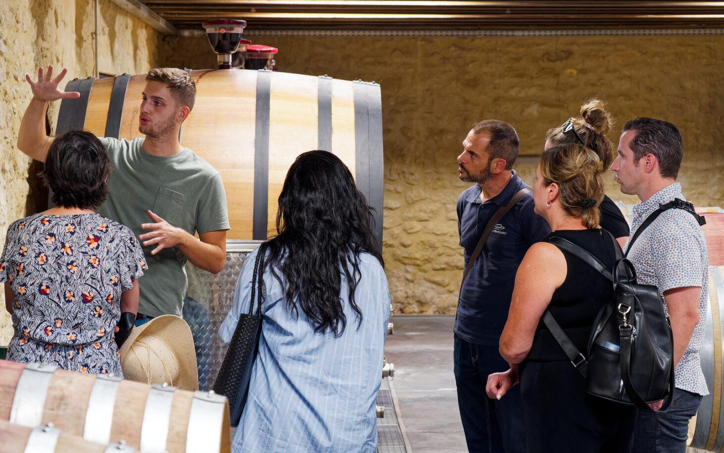 Oak barrels in a Chateauneuf du Pape wine cellar visited on the half-day tour from Avignon