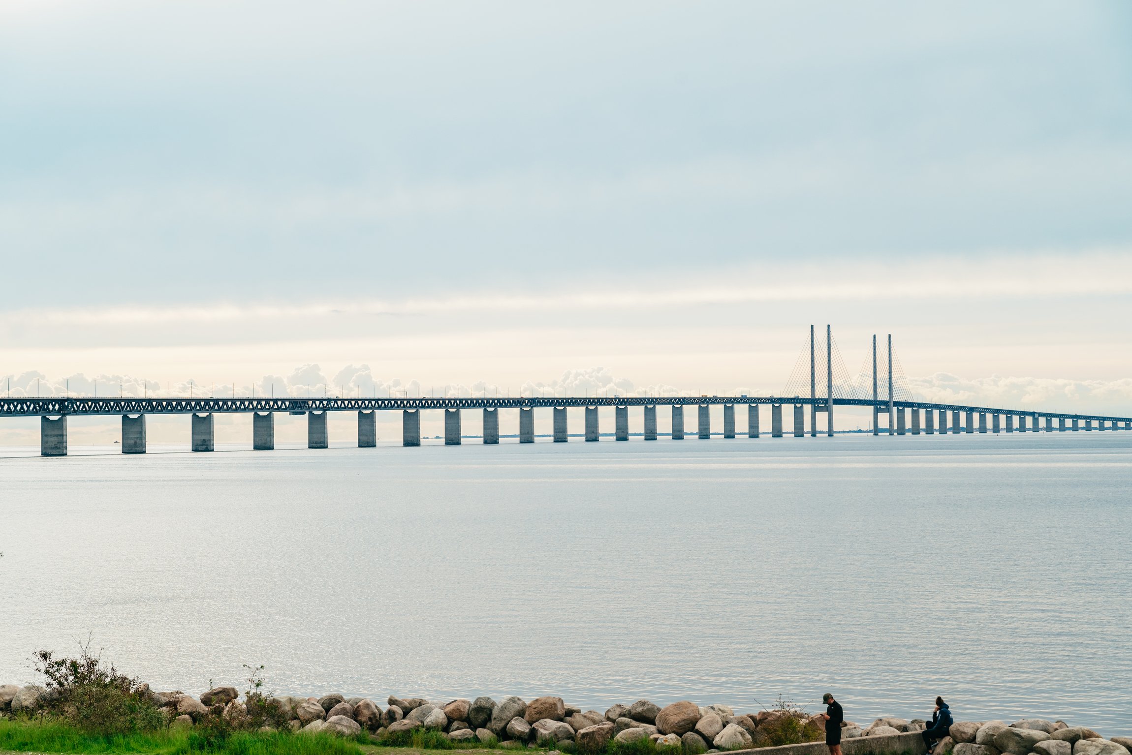 The Øresund Bridge seen from the shore on a calm day