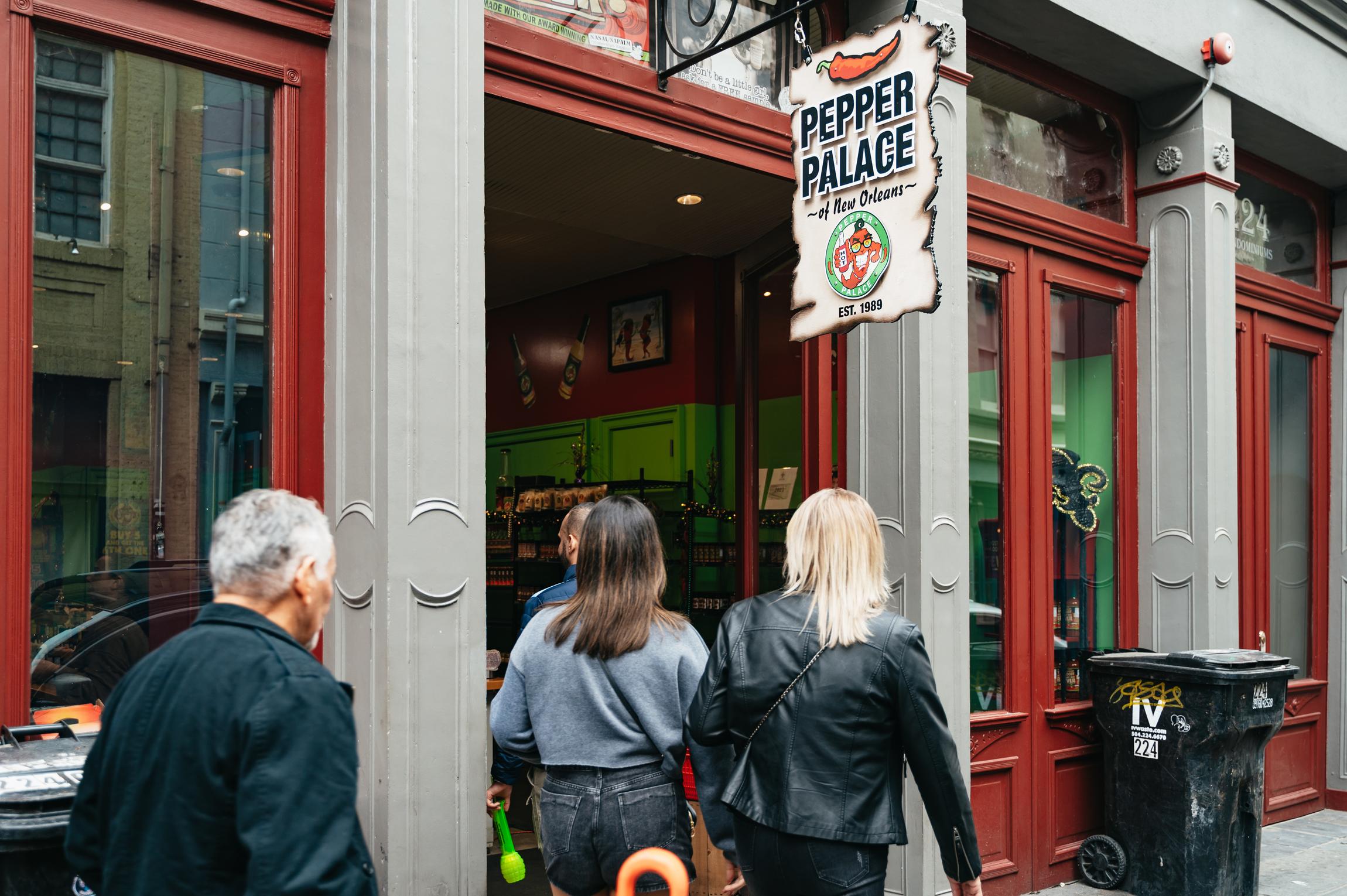Guide explaining New Orleans culinary history on a French Quarter food and history tour