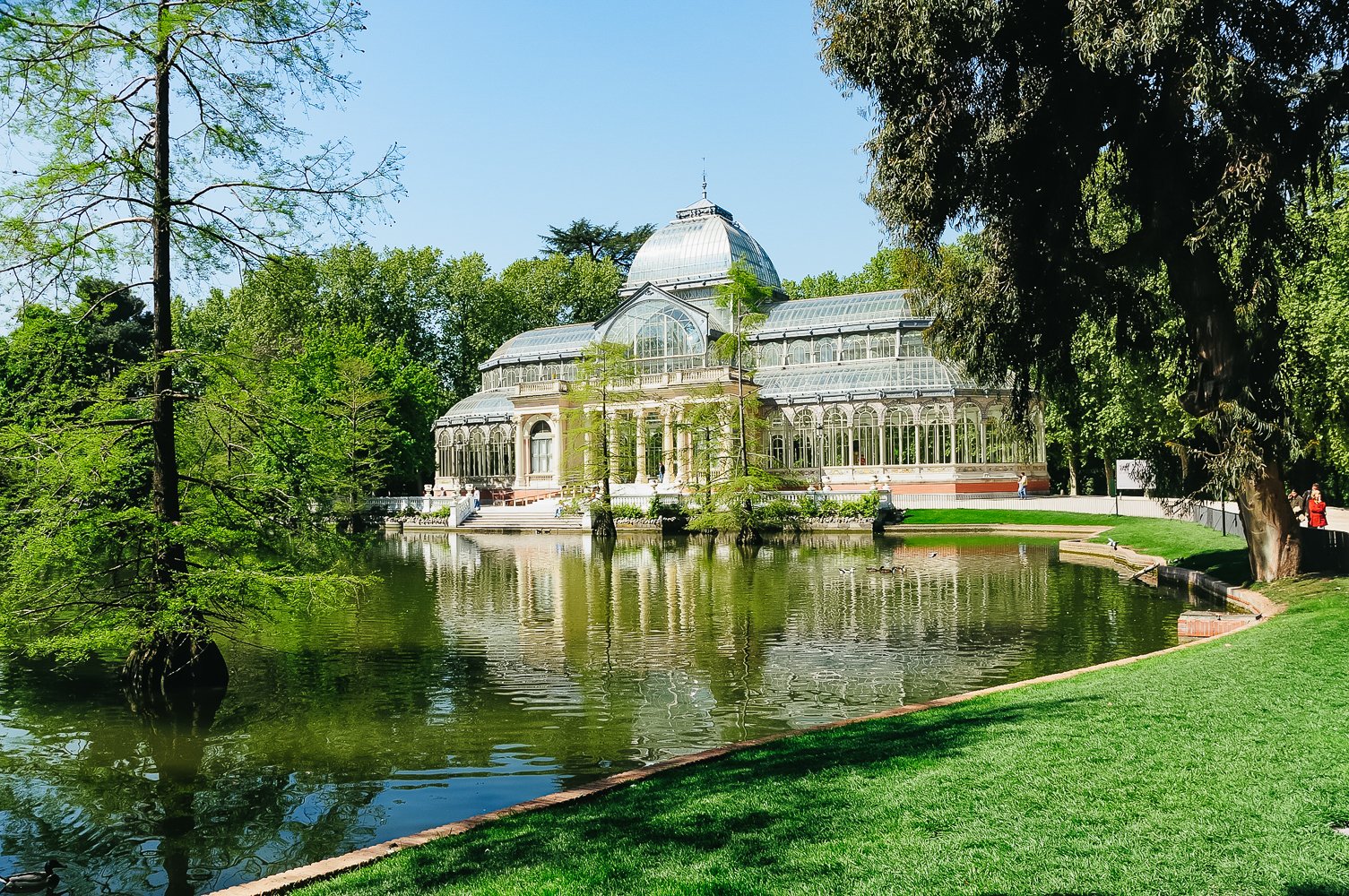 Madrid segway tour — guide narrating Habsburg-era royal history at a Retiro Park monument stop