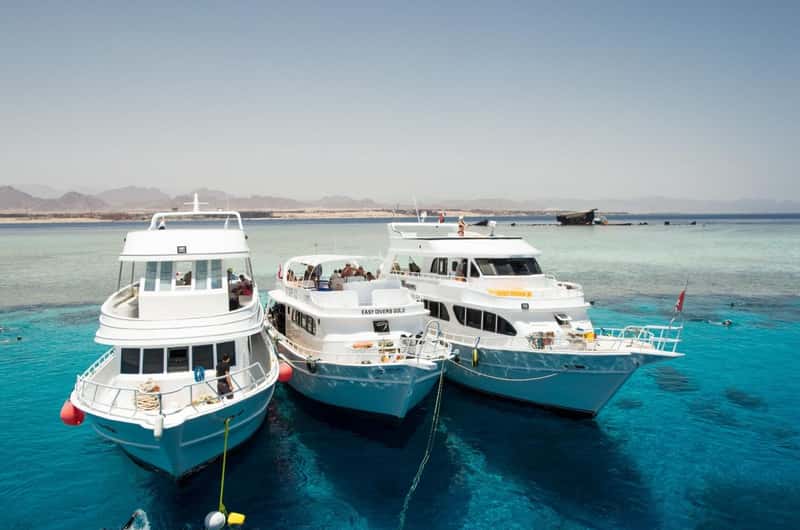 Yacht and snorkelers at Tiran Island