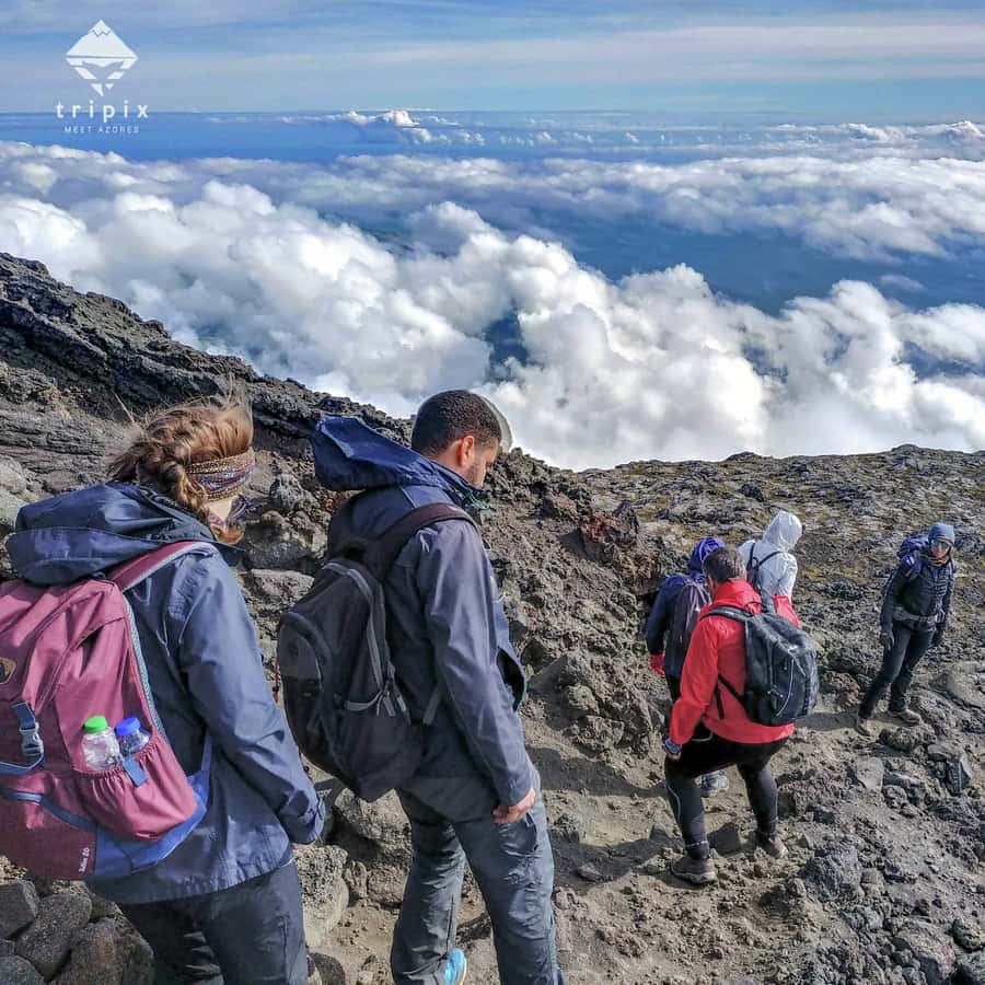 Hikers climbing Mount Pico in the Azores