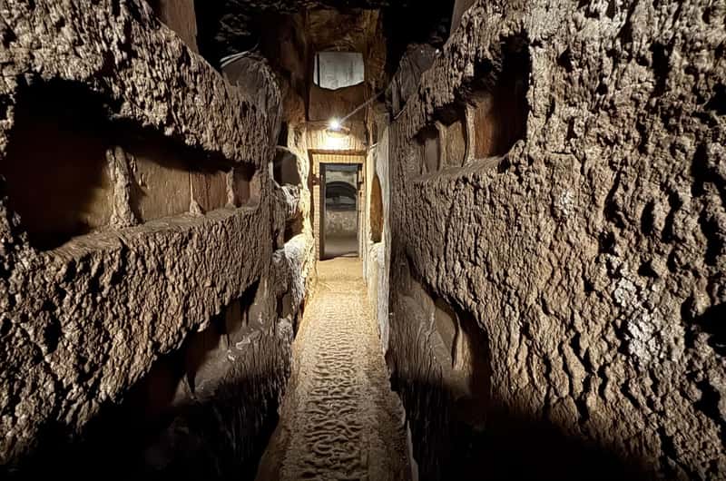 Ancient burial tunnel in the Catacombs of Rome, image from GetYourGuide