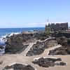 Lava rock pools and seaside fortress