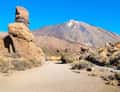 Teide and rock formations on sandy path
