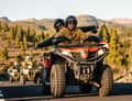 Couple on quad, pine forest road, Teide area