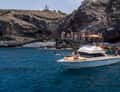 Small boat in rocky cove