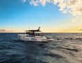 Motor yacht at sunset
