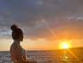 Woman at sea sunset