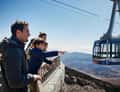 Cable car cabin, family pointing from platform