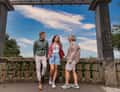 Three people at stone gate