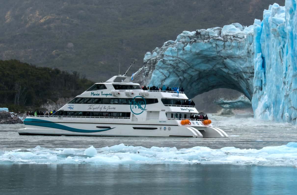Premium catamaran cruising past a glacier front in Los Glaciares National Park, Argentina