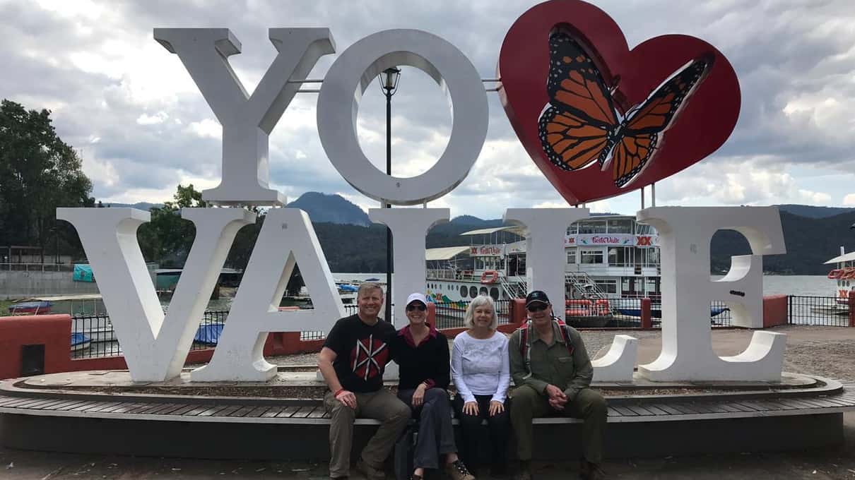 Colorful Valle de Bravo letters sign with a painted monarch butterfly beside the lake