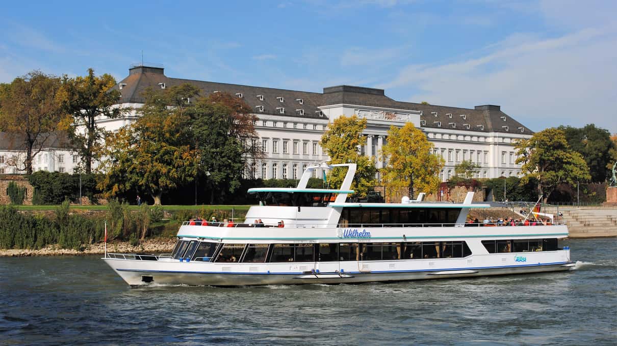A Gilles Rheinschifffahrt passenger boat on the Rhine in front of the Electoral Palace in Koblenz