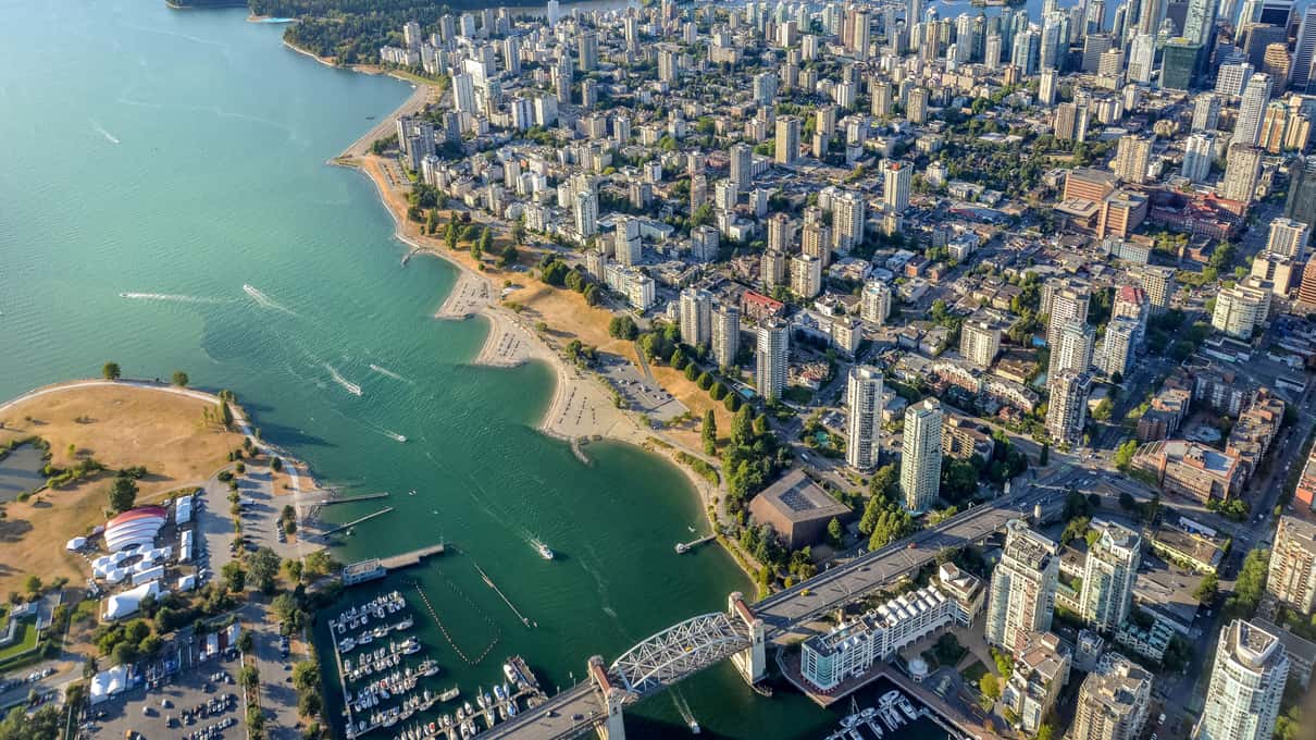Aerial view of English Bay's sandy beaches and the West End's apartment towers from a floatplane leaving Vancouver