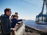 Cable car cabin, family pointing from platform