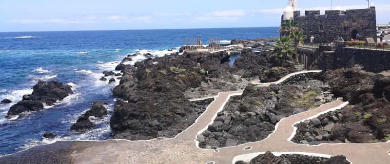 Lava rock pools and seaside fortress