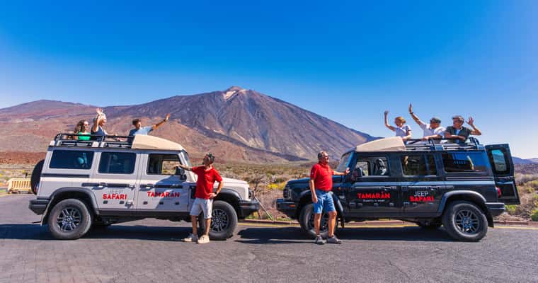Two jeeps in front of Teide, guests on roof