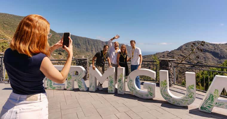 Woman photographing La Orotava letters sign