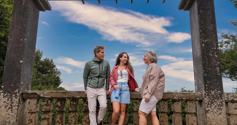 Three people at stone gate